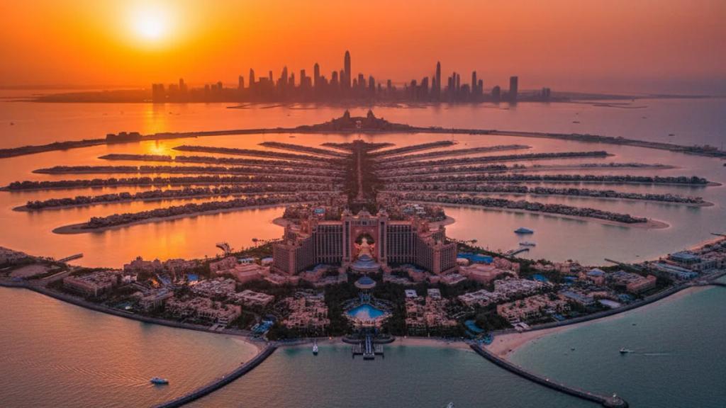 UK traveller on a Dubai rooftop at dusk checking a phone showing a connected mobile signal