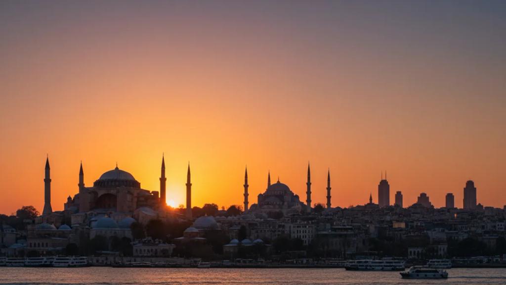 UK traveller by the Bosphorus in Istanbul at golden hour checking a phone with a connected signal