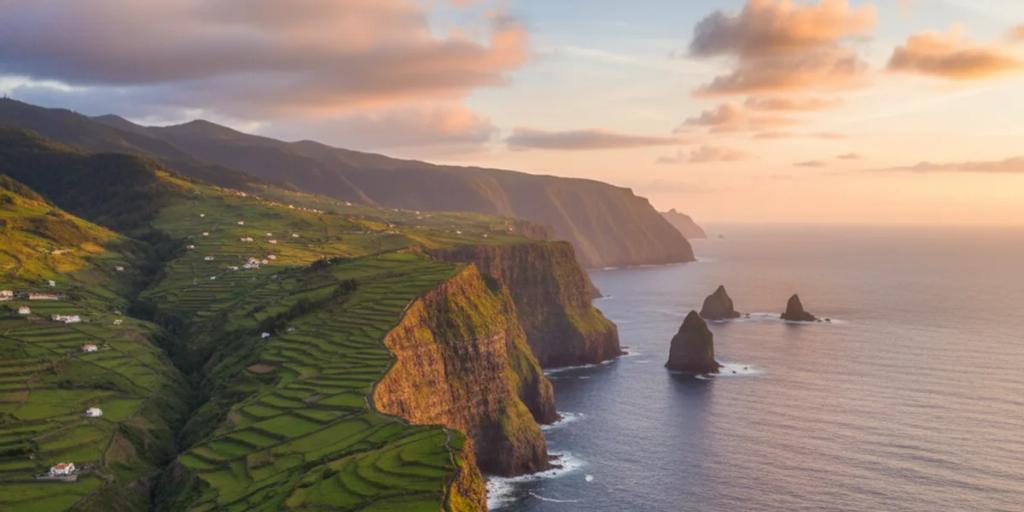 A levada path hugging green cliffs high above the Atlantic on Madeira's north coast