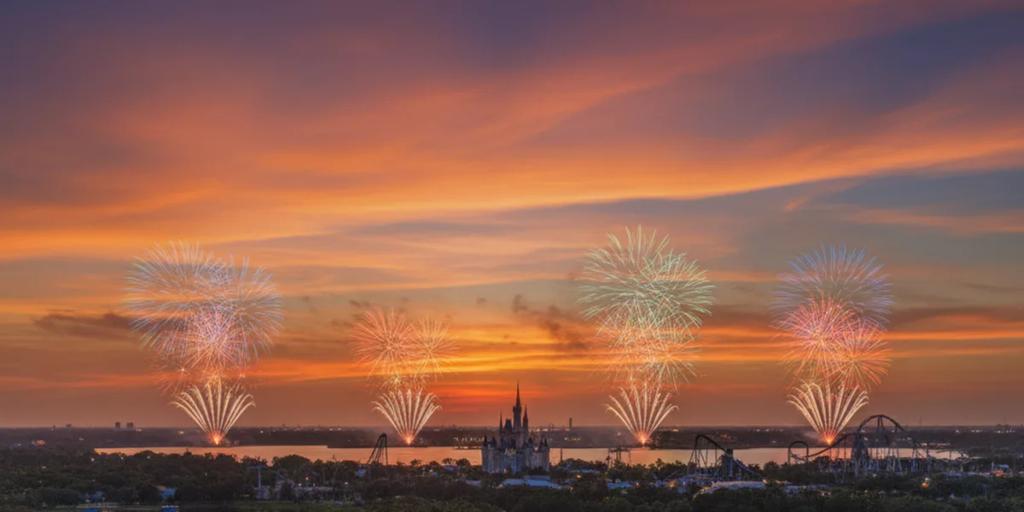 Central Florida lakes at dusk with distant theme-park fireworks lighting the horizon